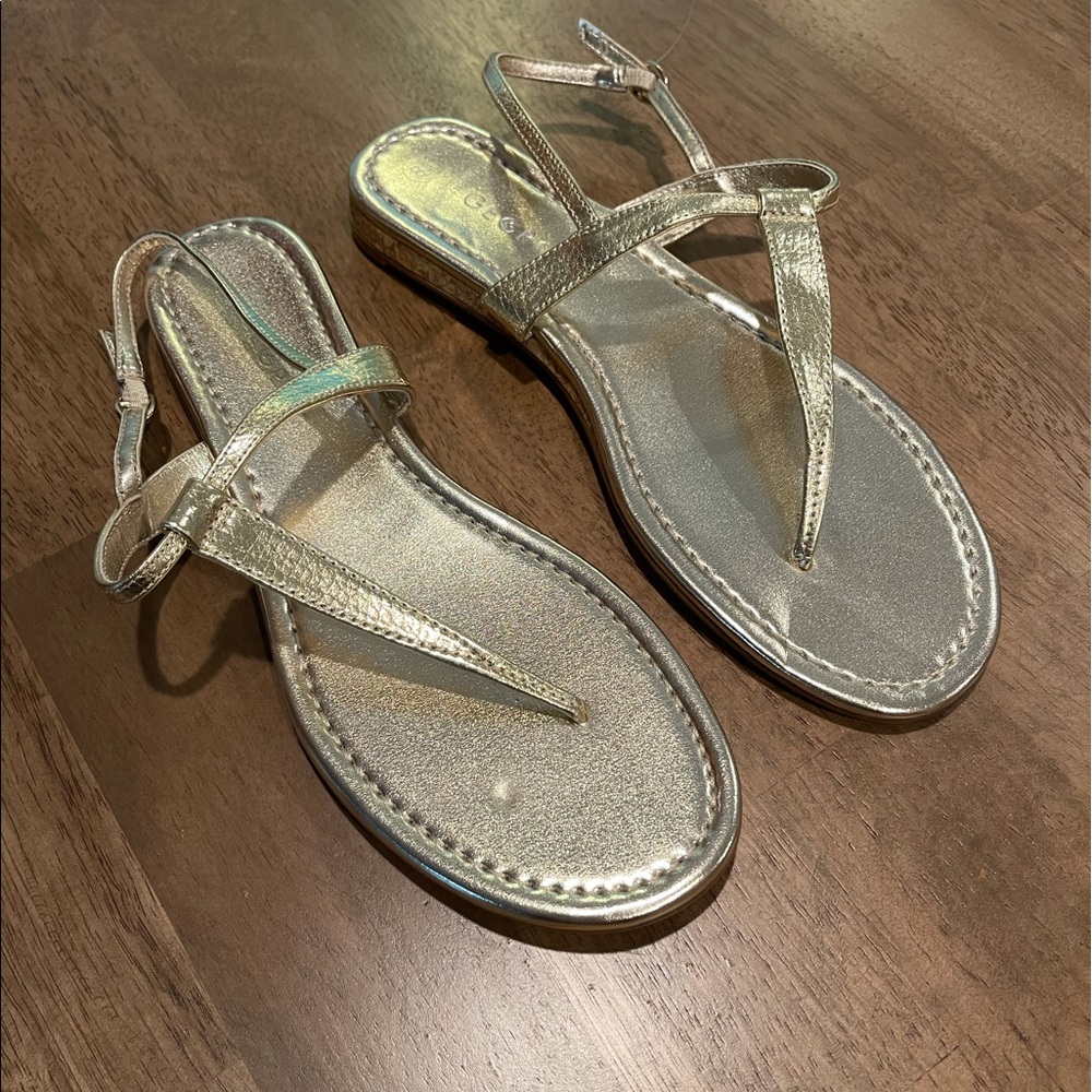 Beautiful gold colored sandals. Buckle back strap